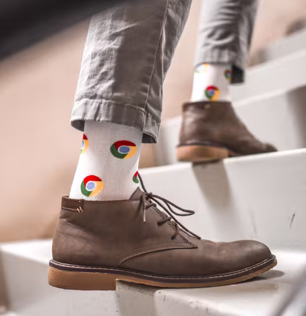 A pair of professional dress socks featuring a custom-embroidered business logo design.