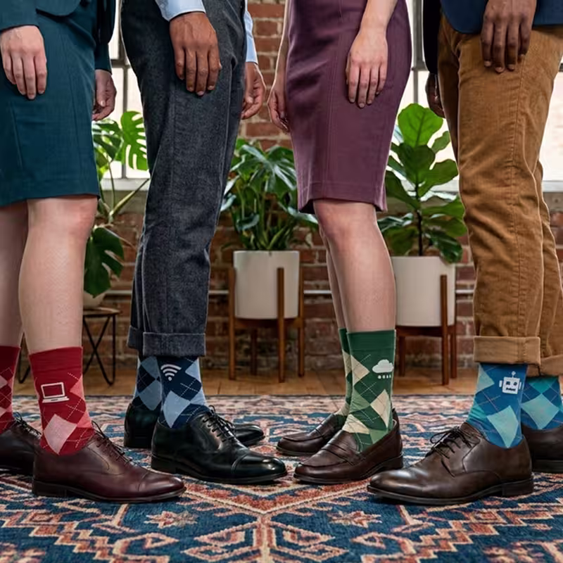 people wearing personalized argyle socks in a office space