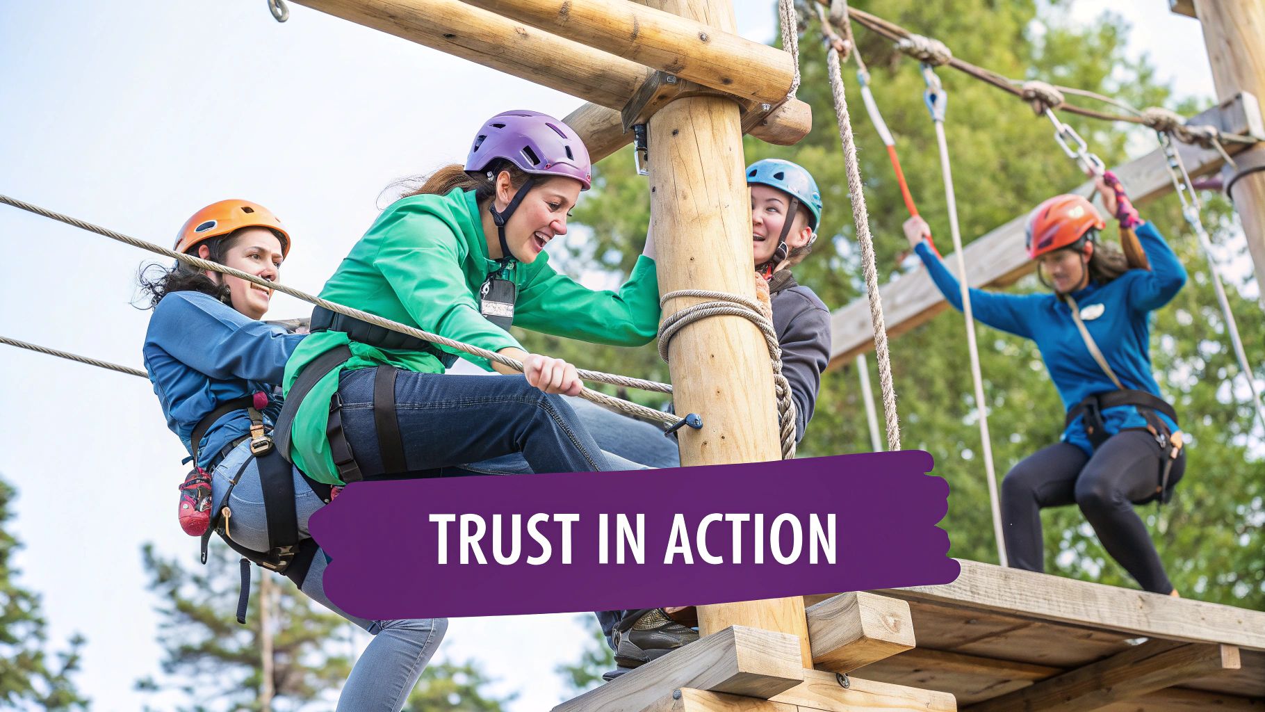 An athletic team participates in a trust-building exercise on a ropes course
