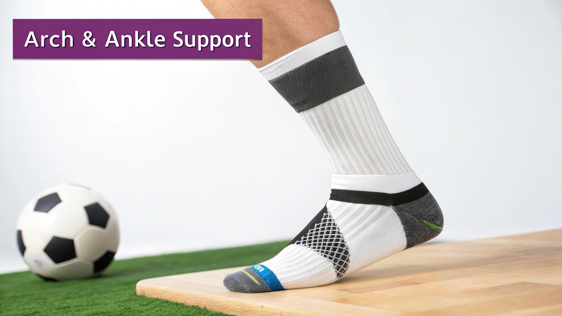 Close-up of a foot in a white athletic sock with arch and ankle support, near a soccer ball.